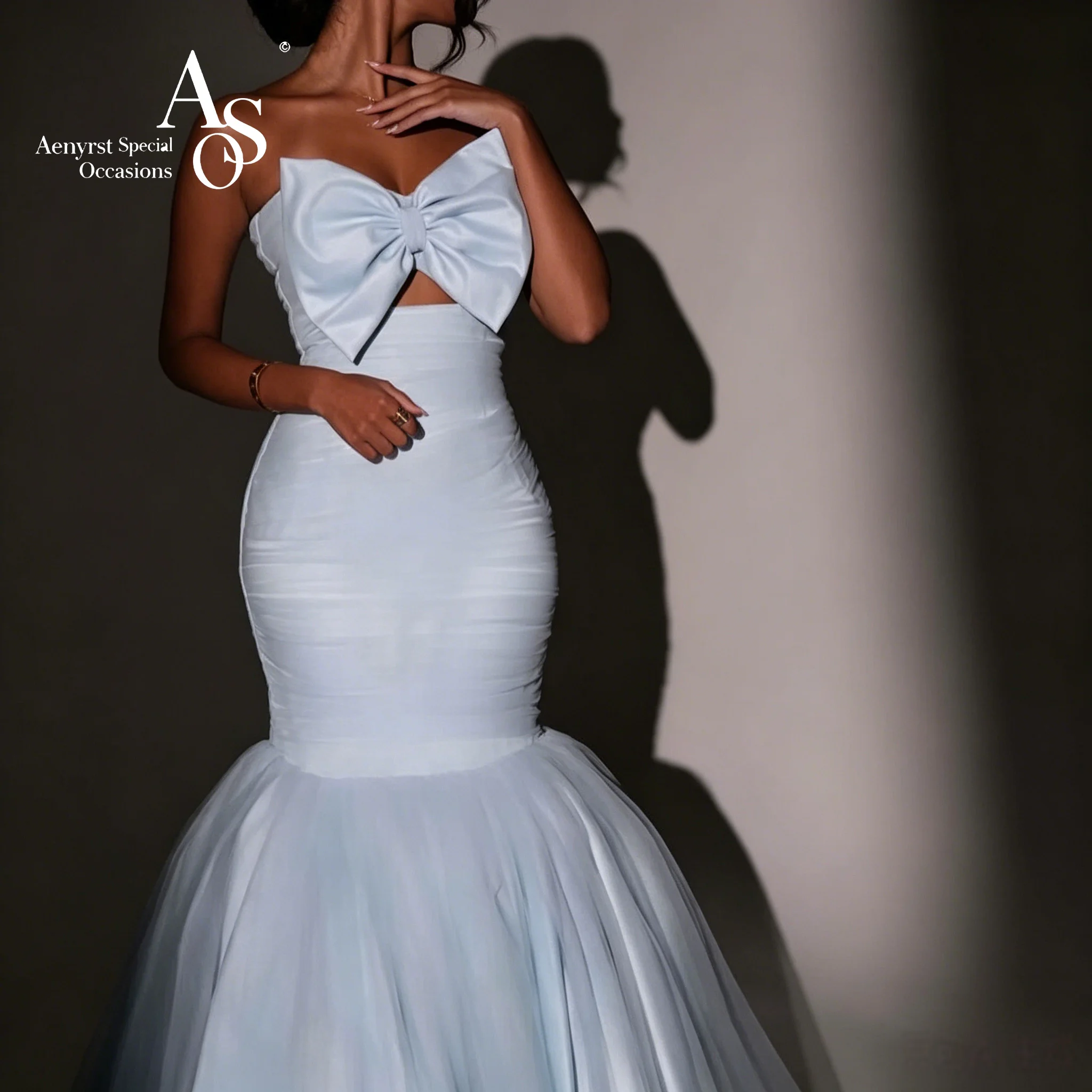 Elegant Blue Strapless Sleeveless Floor-Length Mermaid Formal Gown Featuring a Large Front Bow and Tulle Hem
Elegant Blue Strapless Sleeveless Floor-Length Mermaid Formal Gown Featuring a Large Front Bow and Tulle Hem
