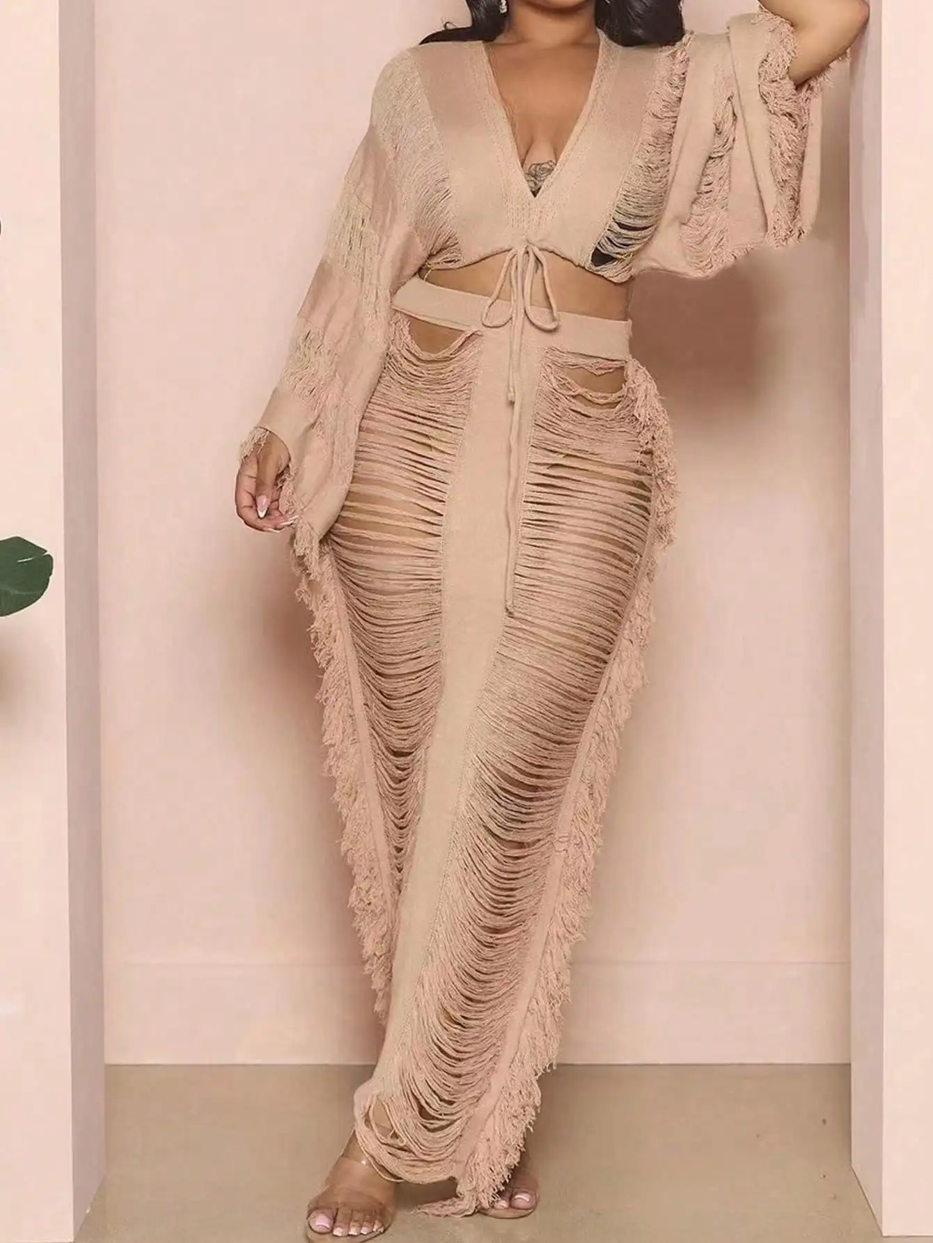 2025 latest women's 2-piece tassel costume long sleeve top and tassel cut-out long skirt
2025 latest women's 2-piece tassel costume long sleeve top and tassel cut-out long skirt