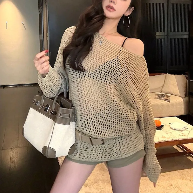 2025 Long Sleeved Loose Korean Version Hollow Knitted Sweater Top New Lazy Off Shoulder Thin Cover Shirt Female Clothing
2025 Long Sleeved Loose Korean Version Hollow Knitted Sweater Top New Lazy Off Shoulder Thin Cover Shirt Female Clothing