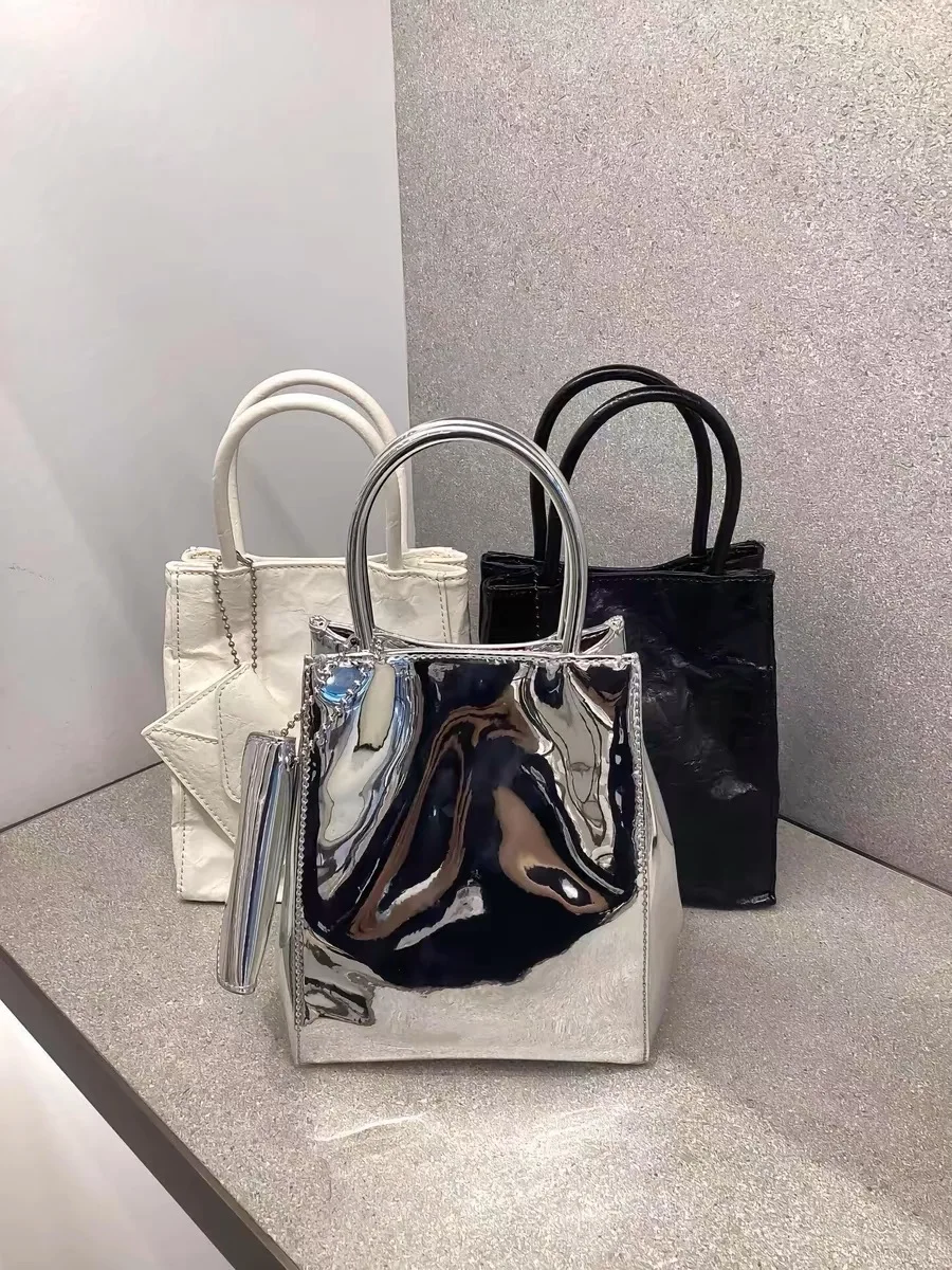 Folded Pure Color Silver Handbag Faionable Small Square Crossbody Bag Paper Bag Sli Trendy Tote Bag for Women
Folded Pure Color Silver Handbag Faionable Small Square Crossbody Bag Paper Bag Sli Trendy Tote Bag for Women