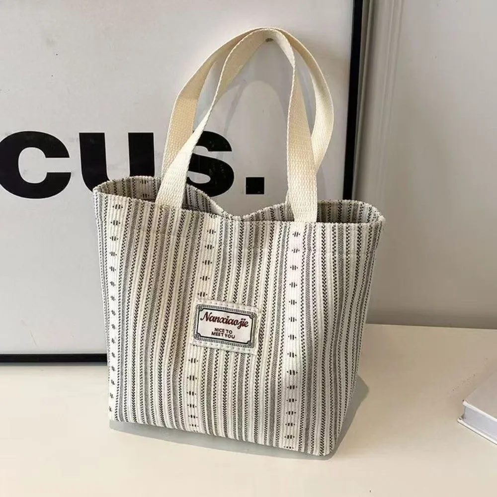 New Versatile Canvas Bag Lightweight Durable Handheld Bag Large Capacity Striped Tote Bag Commuting
New Versatile Canvas Bag Lightweight Durable Handheld Bag Large Capacity Striped Tote Bag Commuting