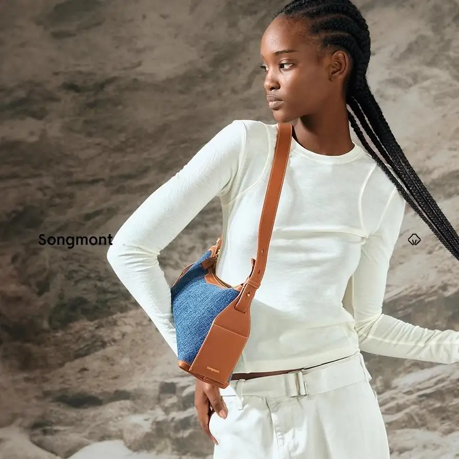 Songmont Ear Series Маленькая джинсовая сумка Сумка-хобо Женская/мужская пригородная джинсовая сумка через плечо
Songmont Ear Series Маленькая джинсовая сумка Сумка-хобо Женская/мужская пригородная джинсовая сумка через плечо