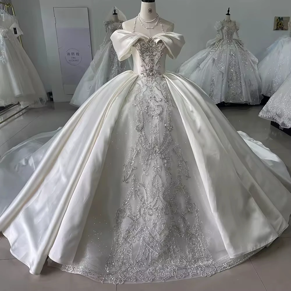 فساتين زفاف 2025 Off Shoulder Sleeveless Lace Up Back Ball Gown Wedding Dress Beading Embroidery Customized Bridal Dressl
فساتين زفاف 2025 Off Shoulder Sleeveless Lace Up Back Ball Gown Wedding Dress Beading Embroidery Customized Bridal Dressl