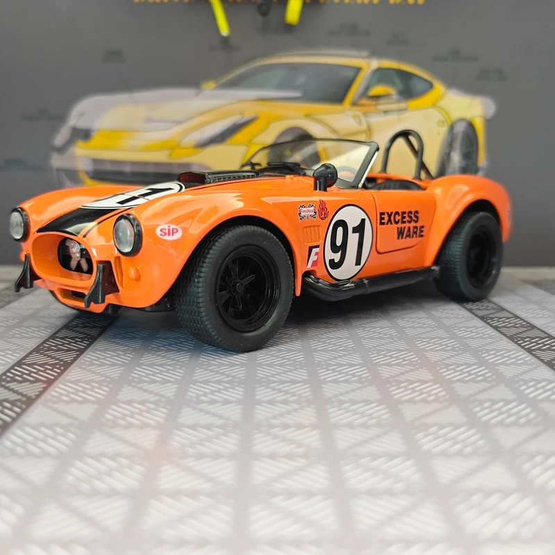 1:22 simulation Ford Cobra convertible sports car alloy model, doors can be opened, sound and light return power car ornaments
1:22 simulation Ford Cobra convertible sports car alloy model, doors can be opened, sound and light return power car ornaments