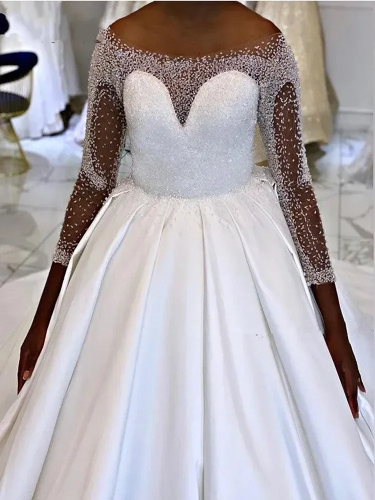 Customized Shinny Full Beads Sequins African A-Line Wedding Dresses Illusion Long Sleeves Satin Church Bridal Dress
Customized Shinny Full Beads Sequins African A-Line Wedding Dresses Illusion Long Sleeves Satin Church Bridal Dress