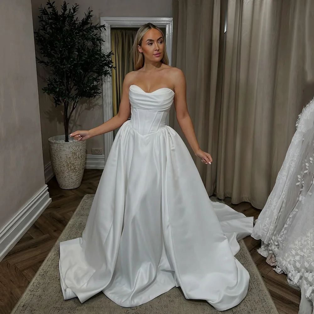 Customized Luxury White Strapless Wedding Dresses 2026 Corset Pleated Bridal Gown Women's Simple Brides Wedding Gown
Customized Luxury White Strapless Wedding Dresses 2026 Corset Pleated Bridal Gown Women's Simple Brides Wedding Gown