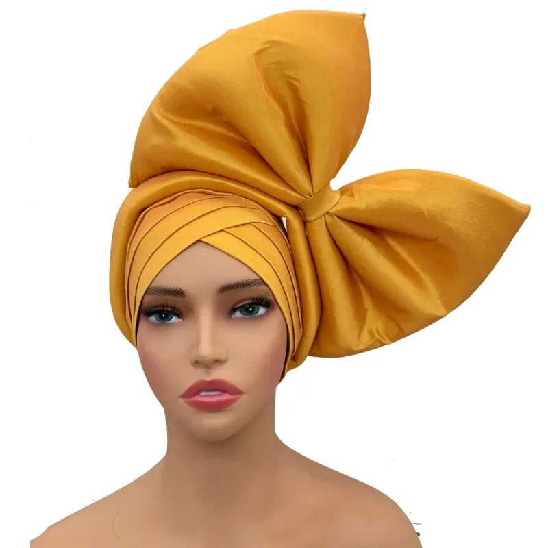 Big Bowknot Turban Cap for Women Exaggerated Headpiece African Auto Gele Headtie Nigeria Party Headwear Hat Lady Head Wraps
Big Bowknot Turban Cap for Women Exaggerated Headpiece African Auto Gele Headtie Nigeria Party Headwear Hat Lady Head Wraps