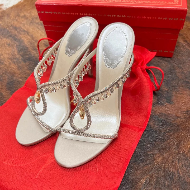 Rhinestone One-word Strap High Heels Slippers Women's 2025 New Summer Sandals Thin Heels Cool Slippers
Rhinestone One-word Strap High Heels Slippers Women's 2025 New Summer Sandals Thin Heels Cool Slippers