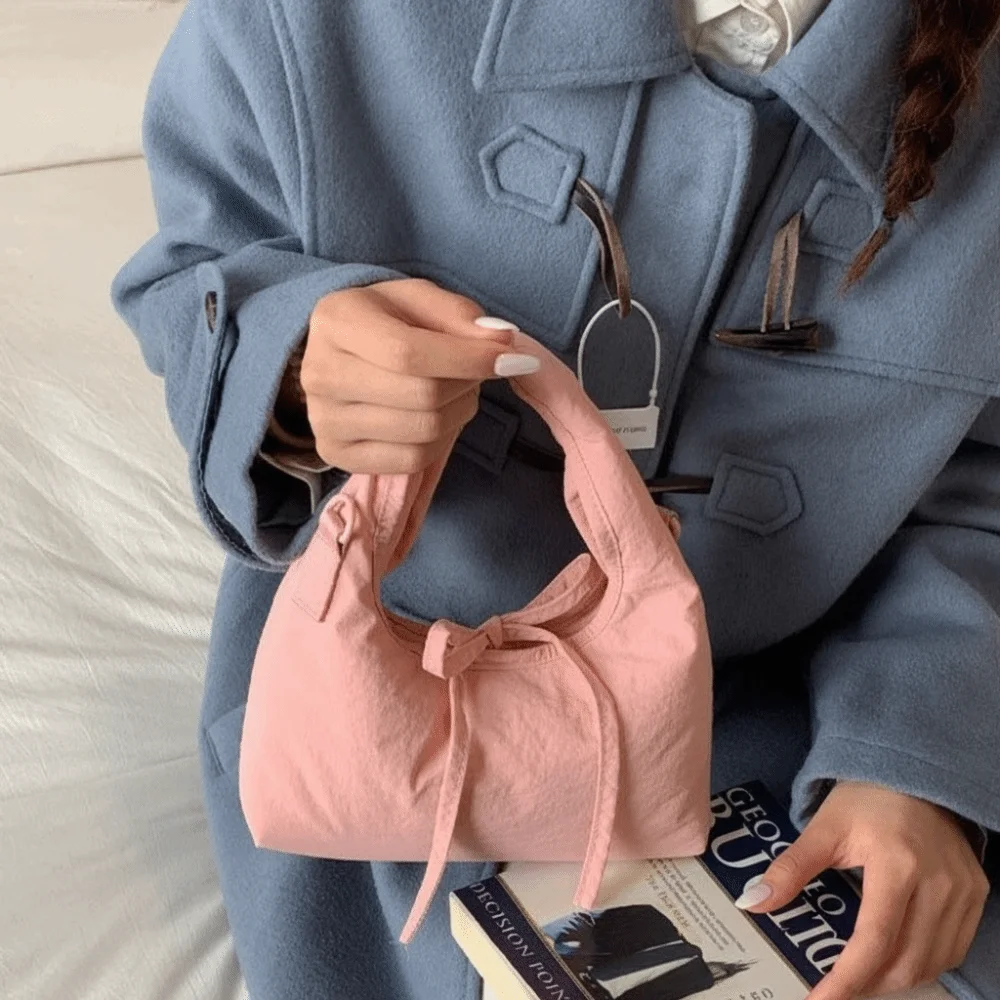 Bow Nylon Shoulder Bag Large Capacity Korean Style Casual Dumpling Bag Handheld Solid Color Oxford Cloth Underarm Bag Women
Bow Nylon Shoulder Bag Large Capacity Korean Style Casual Dumpling Bag Handheld Solid Color Oxford Cloth Underarm Bag Women