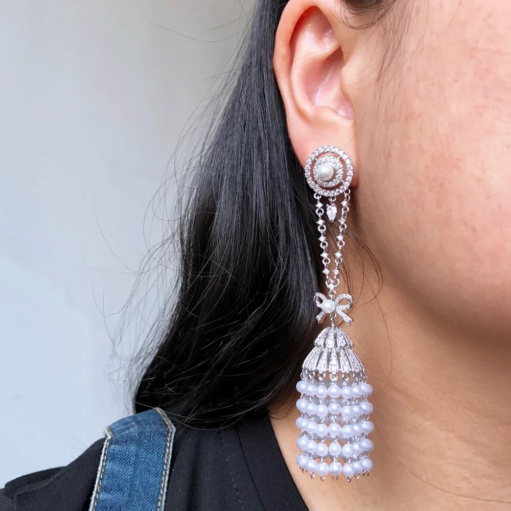 Soramoore Shiny Summer Pearls Long Earrings for Women Fashion Wedding Party Jewelry Ladies Daily Trendy Accessories Hot Sale
Soramoore Shiny Summer Pearls Long Earrings for Women Fashion Wedding Party Jewelry Ladies Daily Trendy Accessories Hot Sale