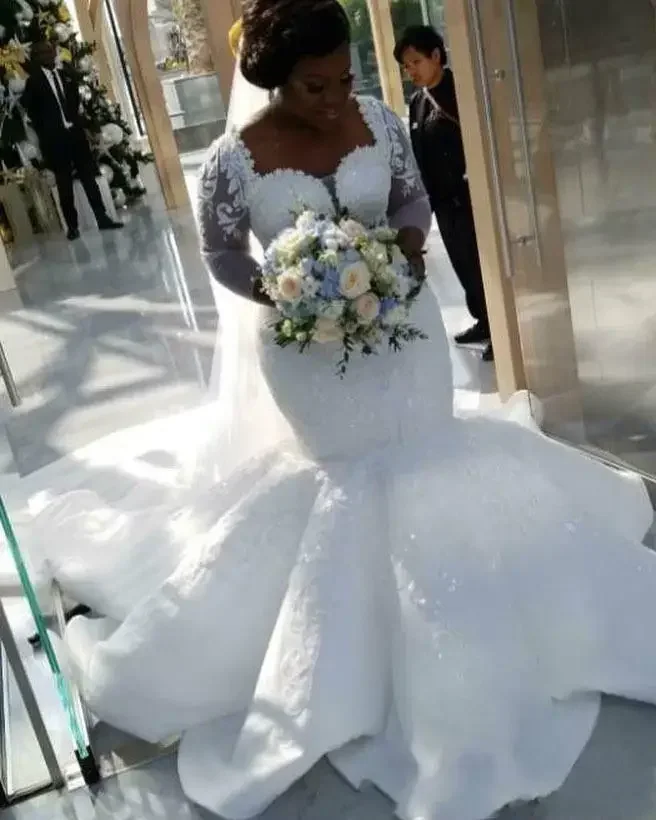 Customized African Mermaid Dresses Lace Appliques Plus Size Sheer Long Sleeves Bridal Gowns Satin Sweep Train Wedding Vestidos
Customized African Mermaid Dresses Lace Appliques Plus Size Sheer Long Sleeves Bridal Gowns Satin Sweep Train Wedding Vestidos