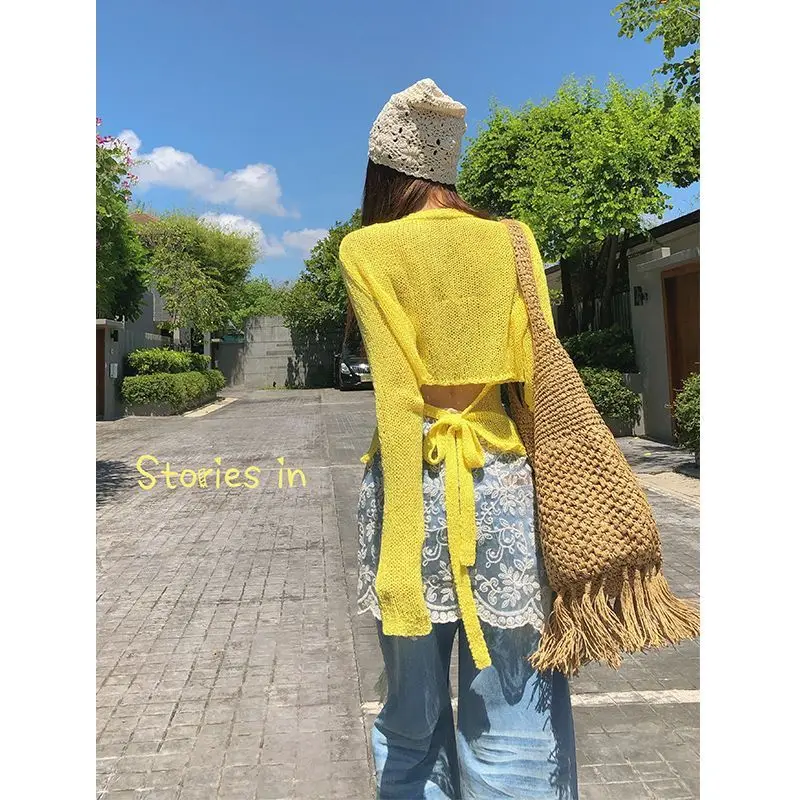 Yellow French hollow long-sleeved knitted cardigan women's 2025 spring new thin design strap sweater top
Yellow French hollow long-sleeved knitted cardigan women's 2025 spring new thin design strap sweater top