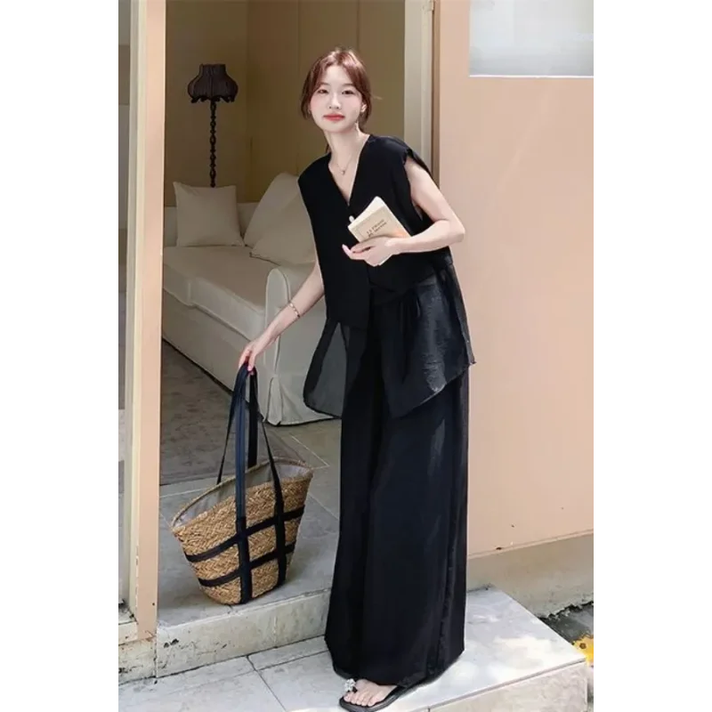 Женский комплект из черных широких брюк и прозрачного топа, свободный повседневный костюм из двух предметов
Женский комплект из черных широких брюк и прозрачного топа, свободный повседневный костюм из двух предметов