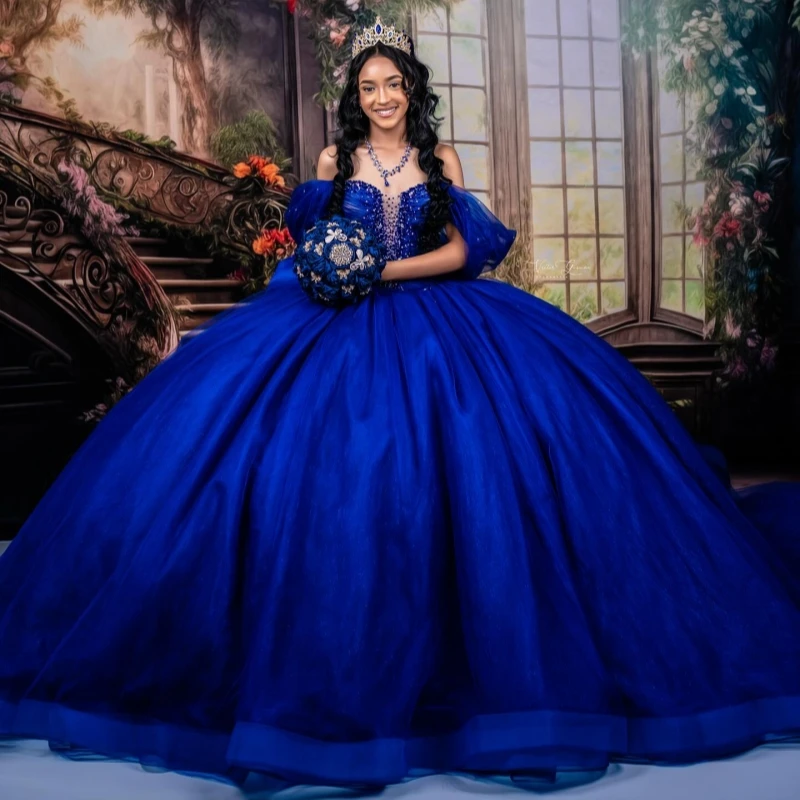 Королевское синее блестящее платье принцессы Quinceanera с открытыми плечами и бисером, с кристаллами и бантом, тюлевое платье Sweet 16, бальное платье Vestidos 15 Anos
Королевское синее блестящее платье принцессы Quinceanera с открытыми плечами и бисером, с кристаллами и бантом, тюлевое платье Sweet 16, бальное платье Vestidos 15 Anos