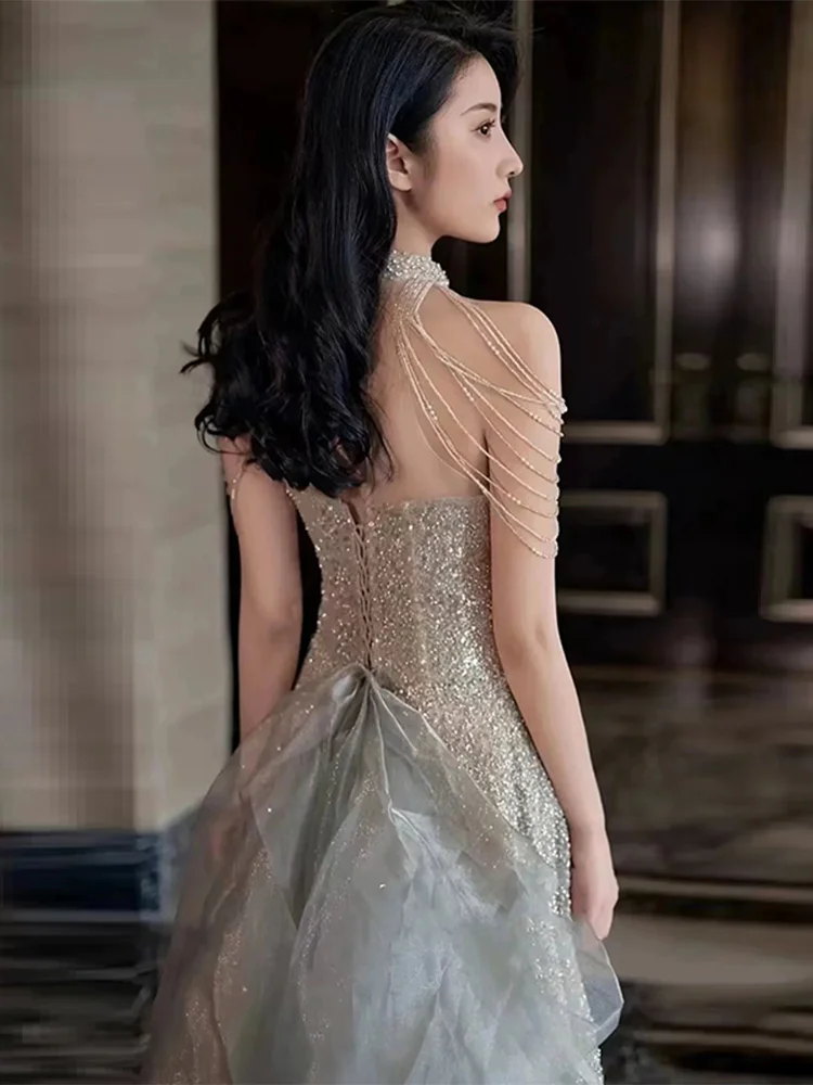 Серебряное вечернее платье с пайетками, роскошное, с бахромой на плечах, для свадьбы, дня рождения, для ведущей, длинная юбка, принцесса, средняя талия, без рукавов
Серебряное вечернее платье с пайетками, роскошное, с бахромой на плечах, для свадьбы, дня рождения, для ведущей, длинная юбка, принцесса, средняя талия, без рукавов