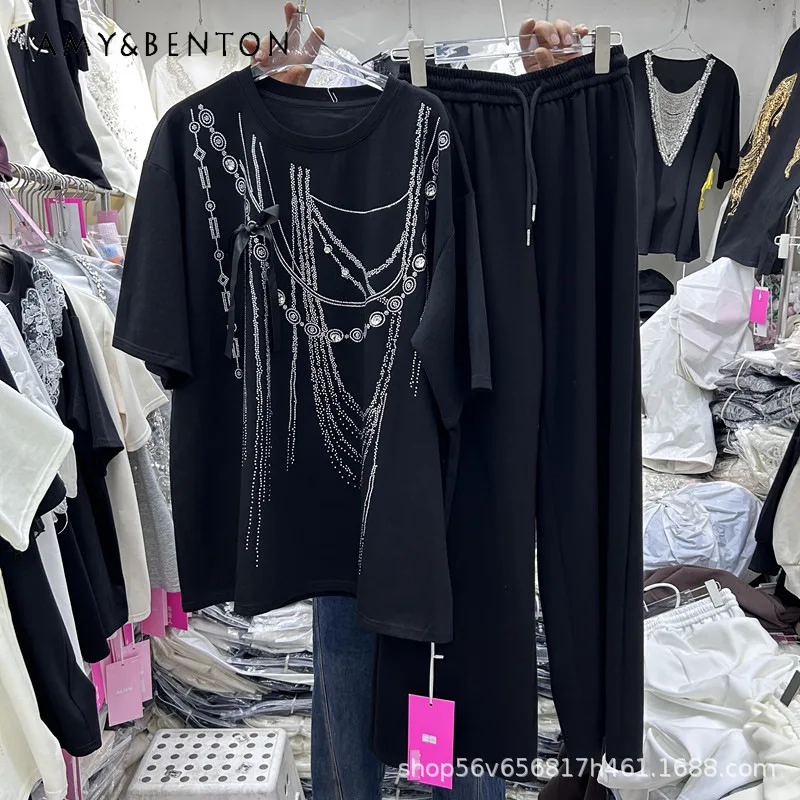 2026 Spring New Heavy Craft Rhinestone Chain Loose Y2k Short-Sleeved T-shirt Top + Elastic Waist Wide-Leg Trousers Two-Piece Set
2026 Spring New Heavy Craft Rhinestone Chain Loose Y2k Short-Sleeved T-shirt Top + Elastic Waist Wide-Leg Trousers Two-Piece Set