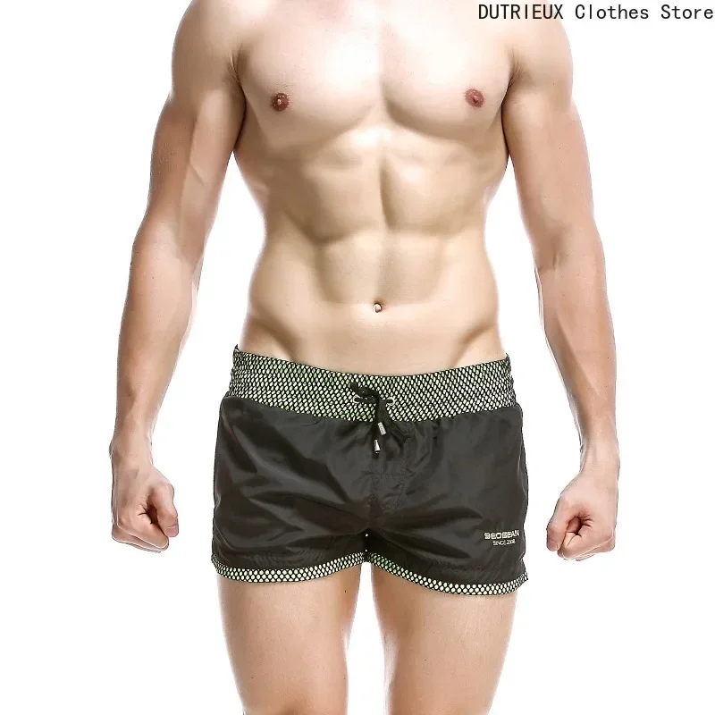 Сексуальные однотонные нейлоновые шорты, быстросохнущие мужские пляжные шорты, модные пляжные шорты, мужские шорты-бермуды
Сексуальные однотонные нейлоновые шорты, быстросохнущие мужские пляжные шорты, модные пляжные шорты, мужские шорты-бермуды