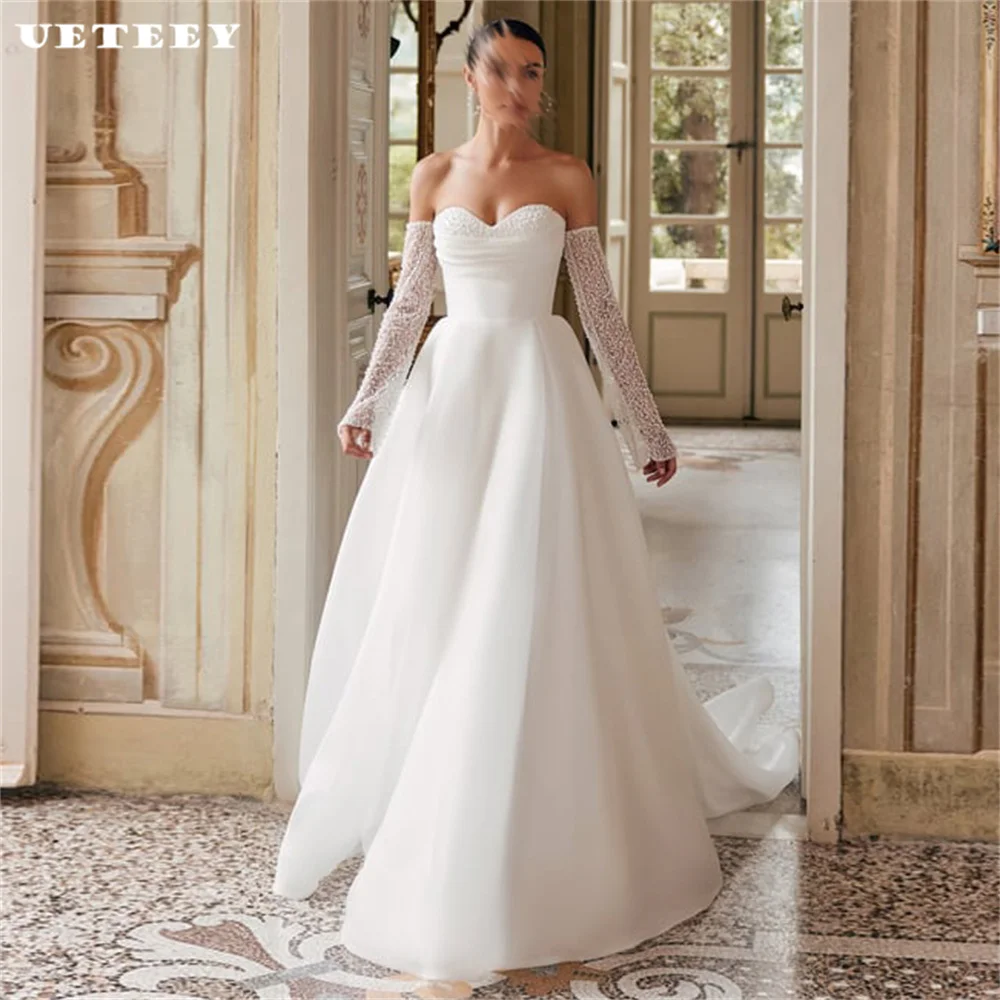 UETEEY Customized Beaded Detachable Off Shoulder Organza Wedding Dress Sweetheart A Line Zipper Back Court Train Bridal Gown
UETEEY Customized Beaded Detachable Off Shoulder Organza Wedding Dress Sweetheart A Line Zipper Back Court Train Bridal Gown