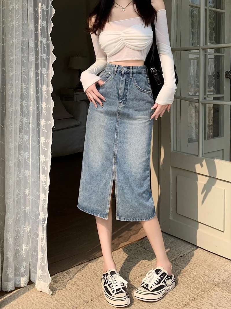 Летняя винтажная джинсовая юбка с высокой талией, средней длины, юбка трапециевидной формы, женская утягивающая юбка с разрезом, корейский Sle, чистый цвет
Летняя винтажная джинсовая юбка с высокой талией, средней длины, юбка трапециевидной формы, женская утягивающая юбка с разрезом, корейский Sle, чистый цвет