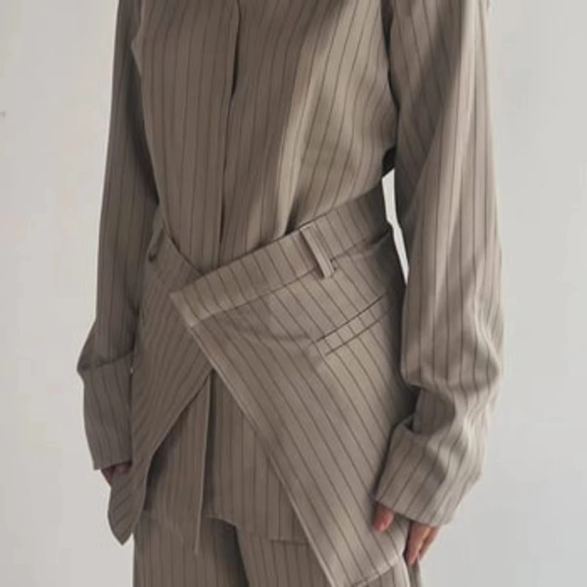 KT Women's Beige Pinstripe Two-Piece Set, Asymmetric Hem Blouse with Waist Belt & Wide Leg Trousers
KT Women's Beige Pinstripe Two-Piece Set, Asymmetric Hem Blouse with Waist Belt & Wide Leg Trousers