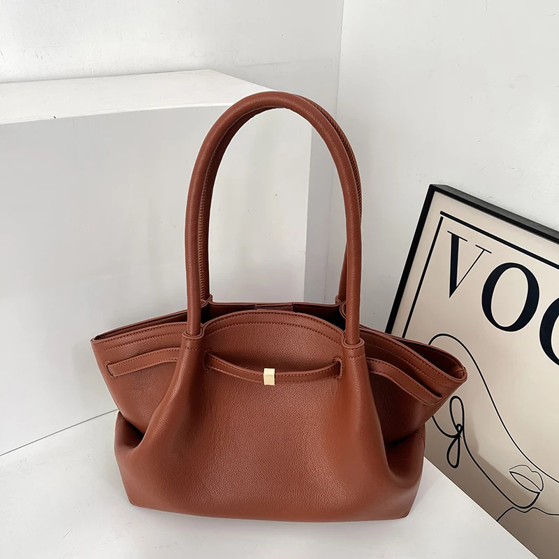 Tote bag for women with a high-end feel, unique design, large capacity, and retro style for commuting and carrying.
Tote bag for women with a high-end feel, unique design, large capacity, and retro style for commuting and carrying.