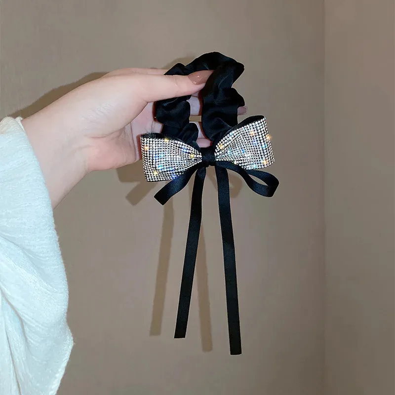 Korean Bow With High Elastic Hair Rope On The Back Of The Head With A Rhinestone With Tassel Ribbon Elegant Simple And Elegant
Korean Bow With High Elastic Hair Rope On The Back Of The Head With A Rhinestone With Tassel Ribbon Elegant Simple And Elegant
