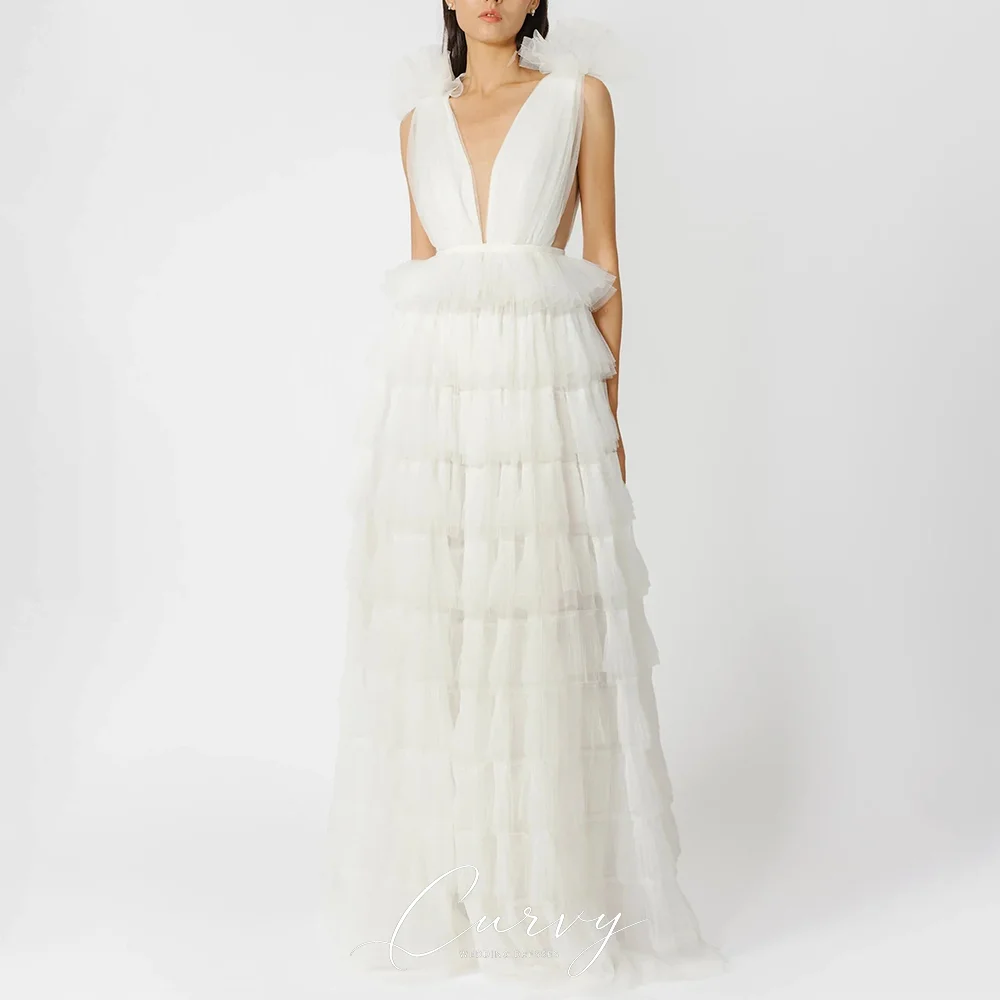 Curvy Dreamy Tulle Sleeveless Strap Deep V Neck Low Back Tiered Ruffle Maxi Custom Outdoor Bridal Dresses for Women 2026
Curvy Dreamy Tulle Sleeveless Strap Deep V Neck Low Back Tiered Ruffle Maxi Custom Outdoor Bridal Dresses for Women 2026