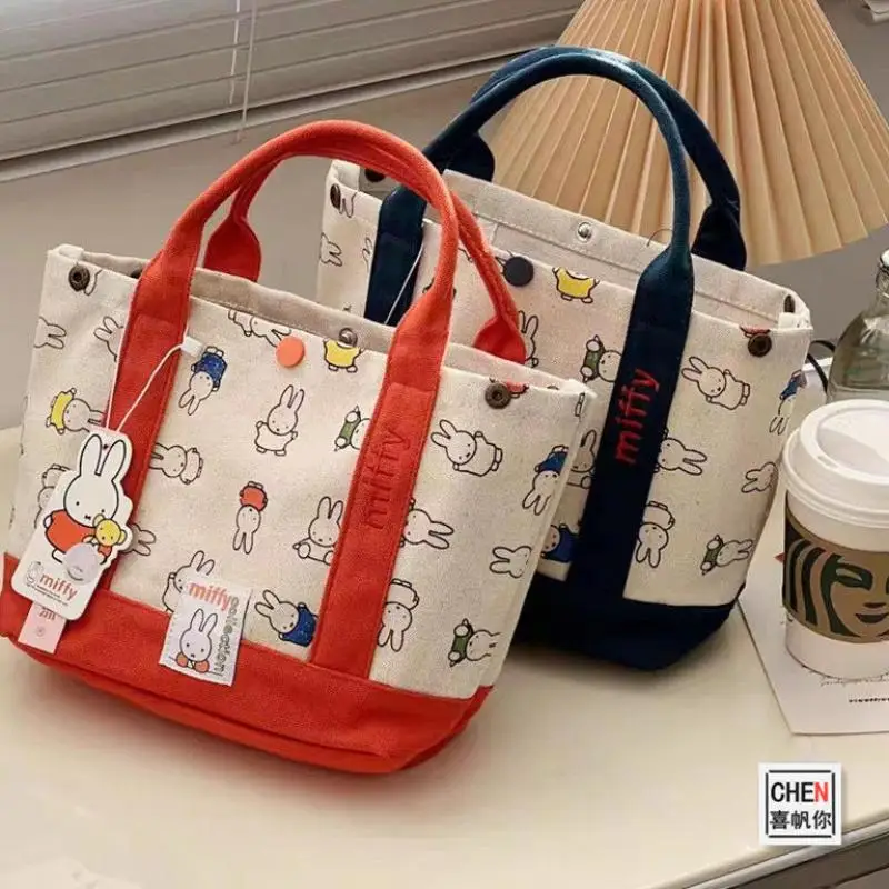 New Cute Printed Canvas Bag Kawaii Anime Cartoon Miffy Fashion Handheld Bento Latch Handbag Birthday Gift for Festival Girls
New Cute Printed Canvas Bag Kawaii Anime Cartoon Miffy Fashion Handheld Bento Latch Handbag Birthday Gift for Festival Girls