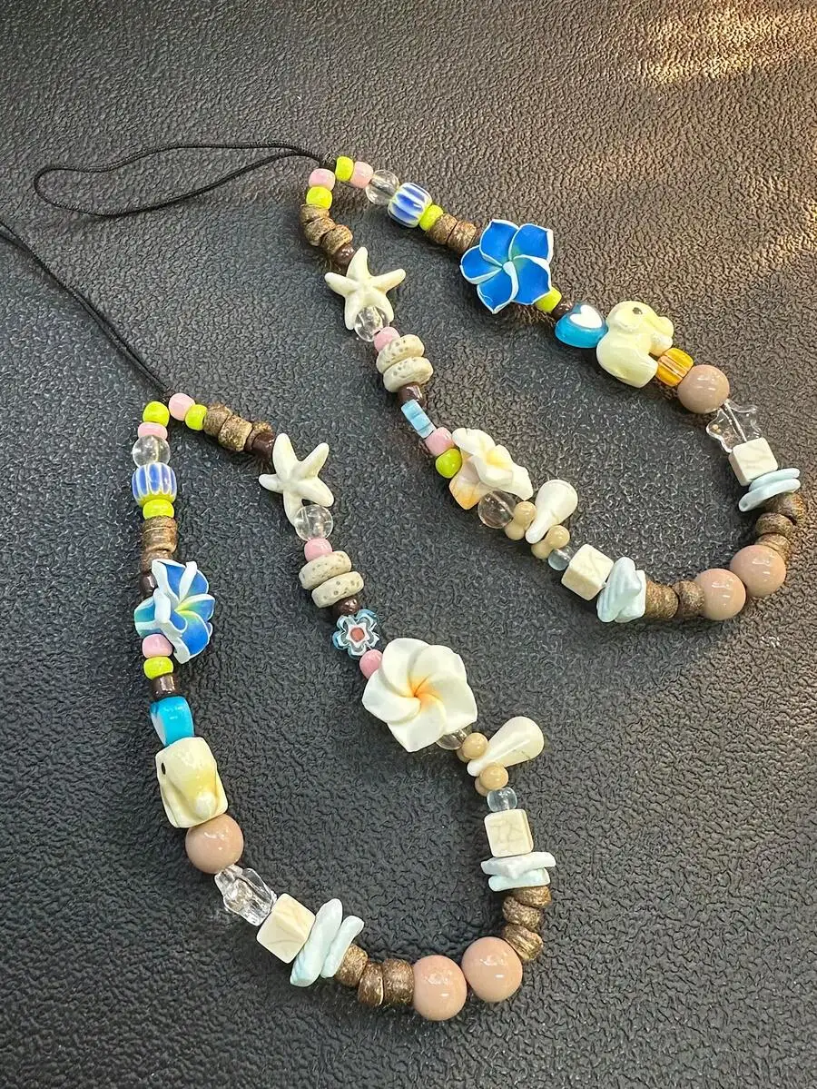 Island Style Beaded Phone Lanyard With Starfish And Flower Charms
Island Style Beaded Phone Lanyard With Starfish And Flower Charms