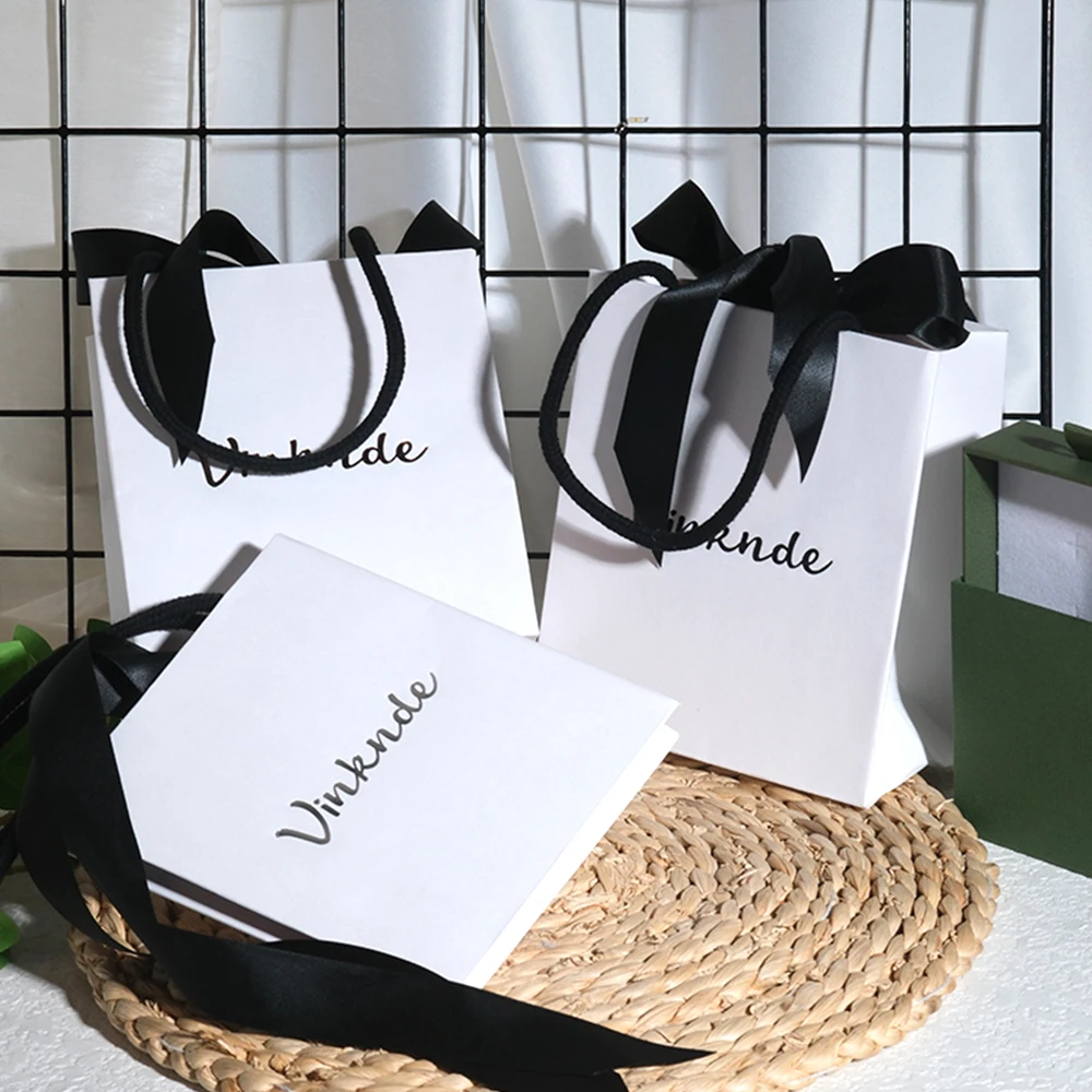 Custom White Paper Bag with Black Ribbon Bow Jewelry Box Gift Bag Shopping Tote Bags Wedding Party Print Logo
Custom White Paper Bag with Black Ribbon Bow Jewelry Box Gift Bag Shopping Tote Bags Wedding Party Print Logo