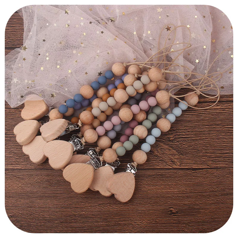 Wooden Pacifier Clip - 2-in-1 Silicone Teether & Holder, Secure & Soothes for Newborns
Wooden Pacifier Clip - 2-in-1 Silicone Teether & Holder, Secure & Soothes for Newborns