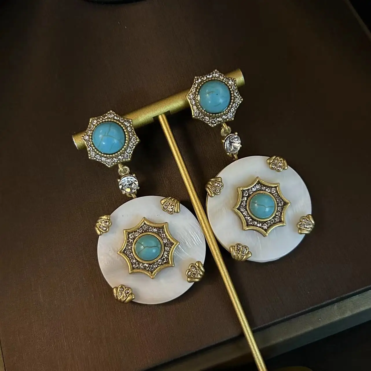 Medieval retro round natural shell relief as old gold turquoise natural stone earrings
Medieval retro round natural shell relief as old gold turquoise natural stone earrings