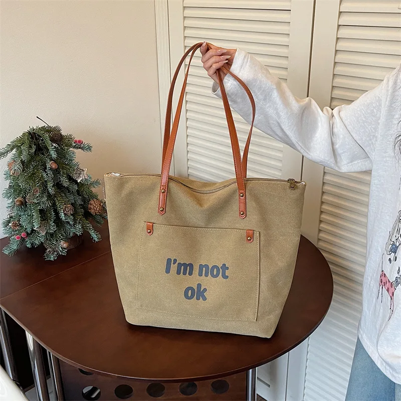 Fashion Korean Retro Tote Bag New Simple Canvas Shoulder Bag with Letter Print Casual Solid Color Commuting Underarm Bag
Fashion Korean Retro Tote Bag New Simple Canvas Shoulder Bag with Letter Print Casual Solid Color Commuting Underarm Bag