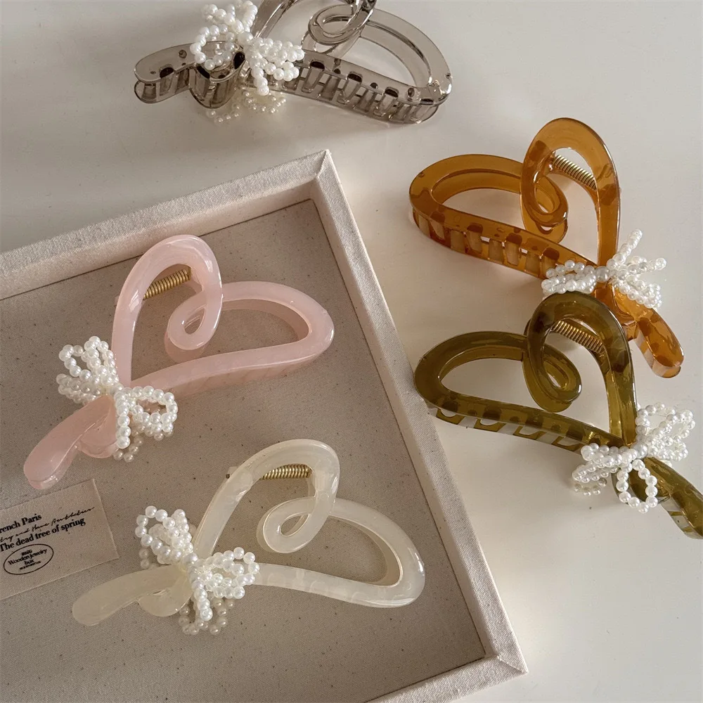 Trendy Heart Bow Hairclip for Women Korean Love Shark Clip Luxury Pearl Hair Clips Temperament Hair Accessories Summer Headwear
Trendy Heart Bow Hairclip for Women Korean Love Shark Clip Luxury Pearl Hair Clips Temperament Hair Accessories Summer Headwear