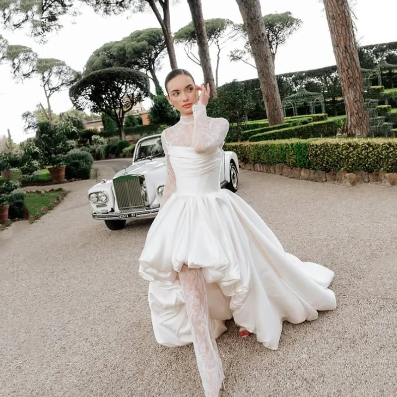 Modern High/low Stain Wedding Dresses Ivory Sexy Lace Long Sleeves High Neck Ball Gowns Above Knee 2026 Sweep Train Customized
Modern High/low Stain Wedding Dresses Ivory Sexy Lace Long Sleeves High Neck Ball Gowns Above Knee 2026 Sweep Train Customized