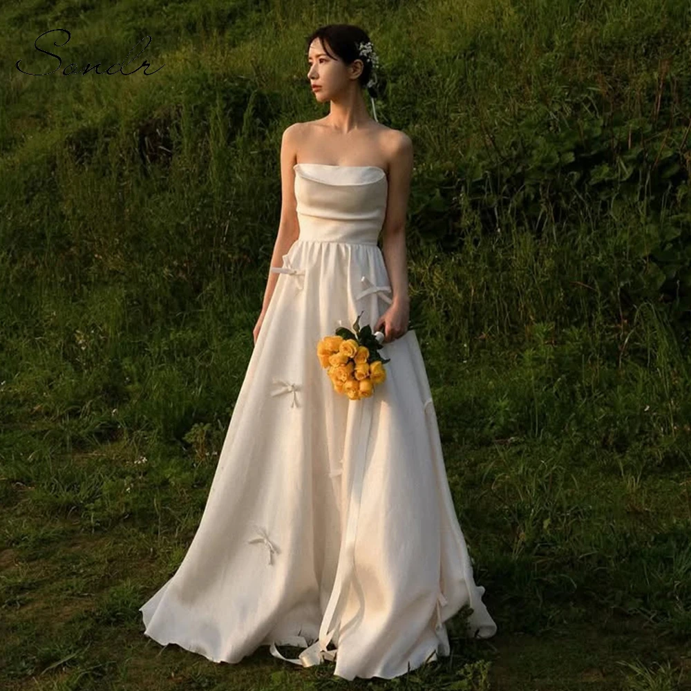 Sondr A Line Silk Satin Bow Korean Wedding Dresses Customized Strapless Elegant Corset Bridal Gown Outdoor Wedding Snap Dresses
Sondr A Line Silk Satin Bow Korean Wedding Dresses Customized Strapless Elegant Corset Bridal Gown Outdoor Wedding Snap Dresses