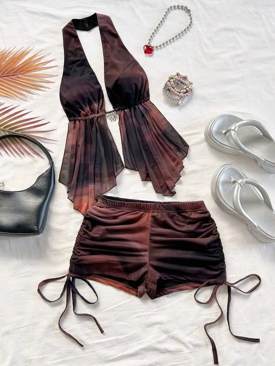 Богемный комплект из асимметричной блузки с воротником-халтер и шорт для летнего пляжного отдыха
Богемный комплект из асимметричной блузки с воротником-халтер и шорт для летнего пляжного отдыха