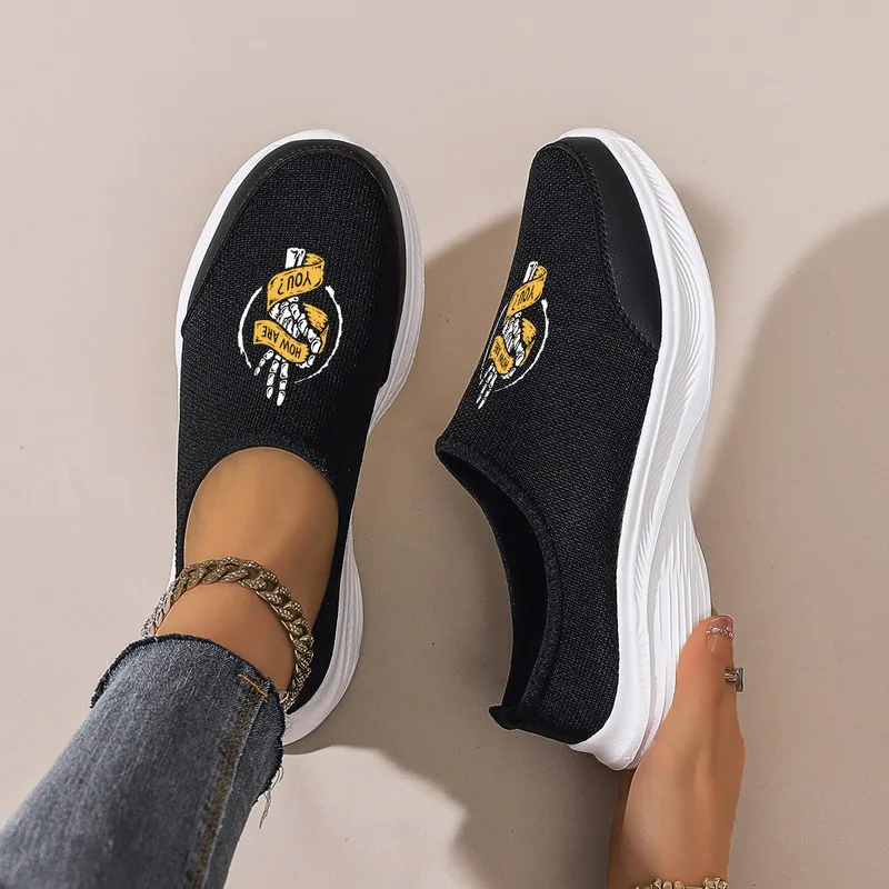Women's Black Slip-On Platform Sneakers: Breathable Mesh Upper, Comfortable for Daily Wear. Pair with Jeans & Casual Pants.
Women's Black Slip-On Platform Sneakers: Breathable Mesh Upper, Comfortable for Daily Wear. Pair with Jeans & Casual Pants.