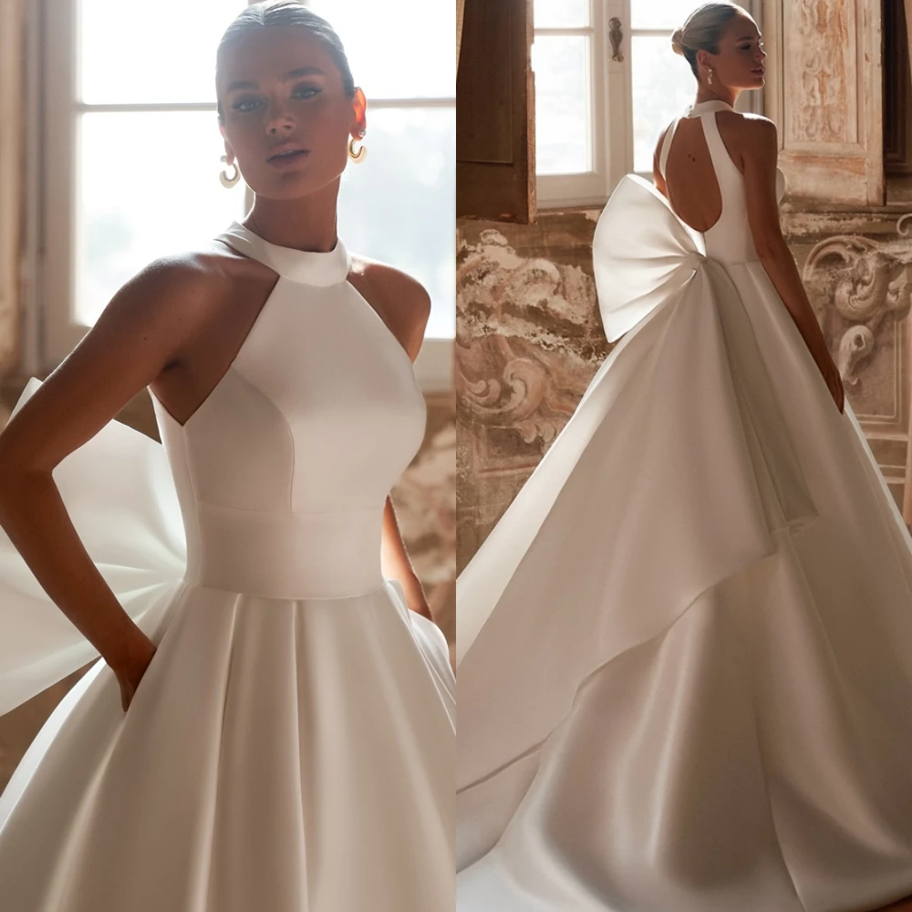 Customized High Quality White Satin Bridal Gowns Luxury Chapel Train Wedding Dress with Bow Simple A-Line Halter Robe de mariée
Customized High Quality White Satin Bridal Gowns Luxury Chapel Train Wedding Dress with Bow Simple A-Line Halter Robe de mariée
