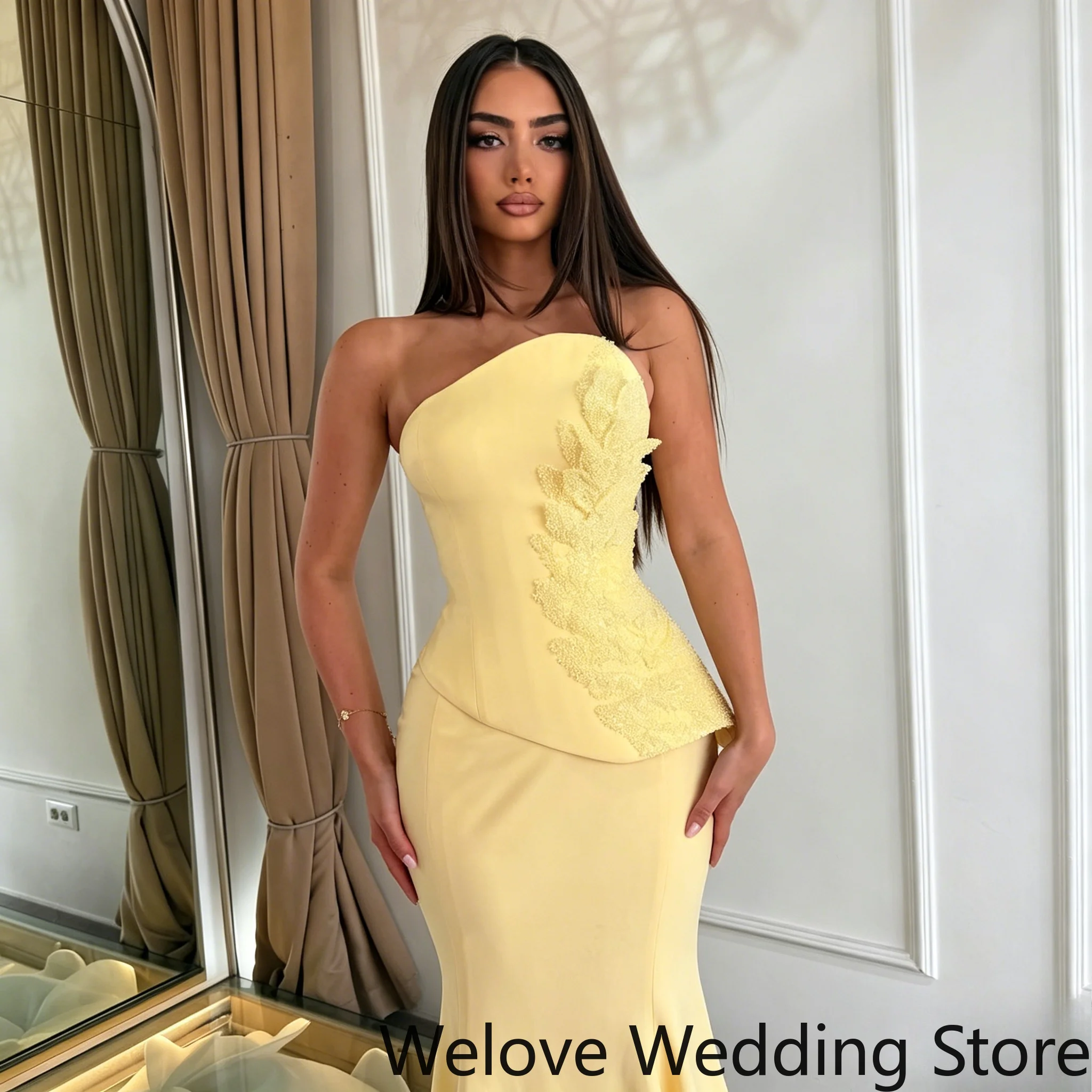 Bright Yellow Formal Evening Gown featuring a sleek strapless design, an asymmetrical neckline and a fitted corset-style bodice
Bright Yellow Formal Evening Gown featuring a sleek strapless design, an asymmetrical neckline and a fitted corset-style bodice