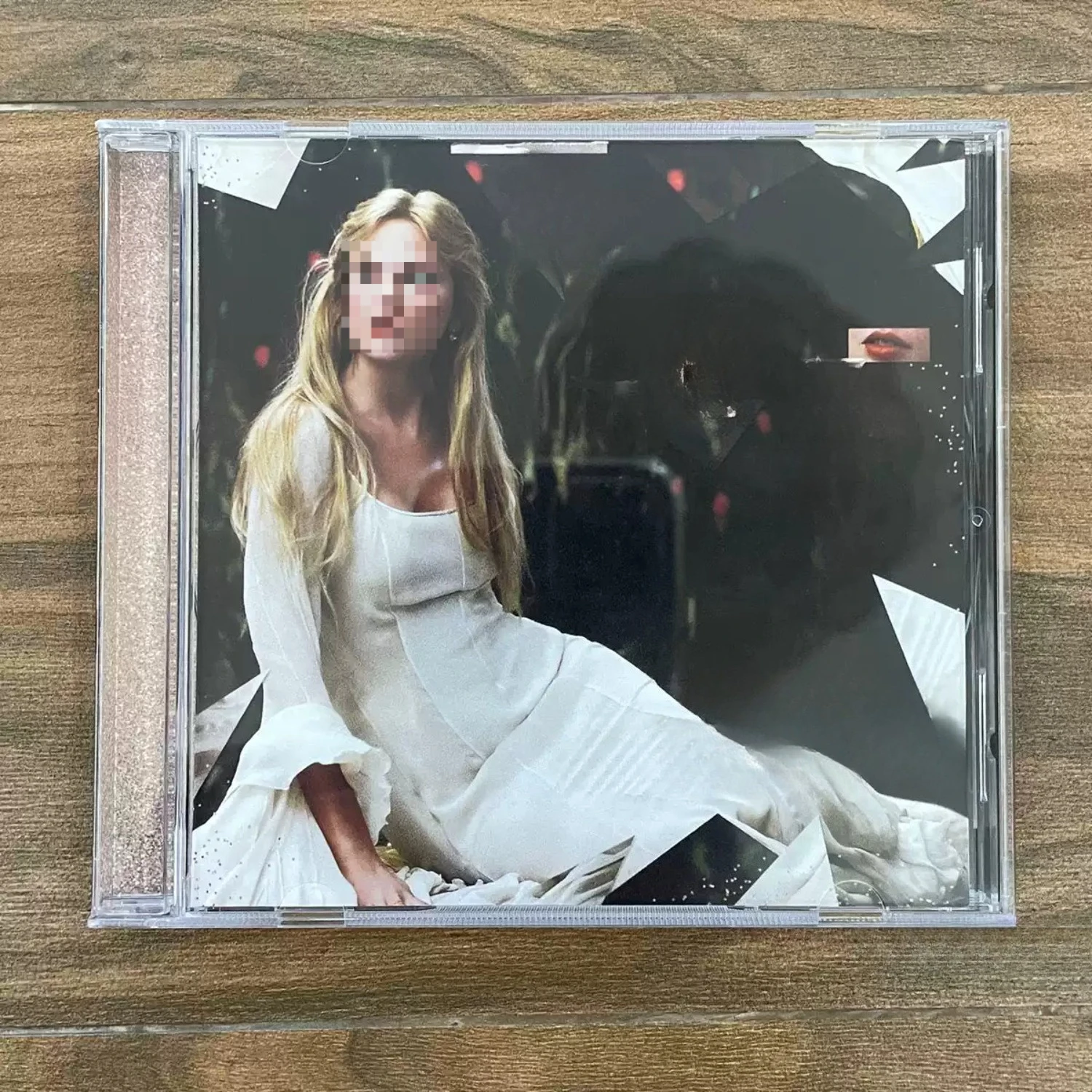 Iconic Narrative Pop CD with Moody Dark Toned White-Dress Showgirl Portrait Artwork, Glitter Text Accents Audio Collectible
Iconic Narrative Pop CD with Moody Dark Toned White-Dress Showgirl Portrait Artwork, Glitter Text Accents Audio Collectible