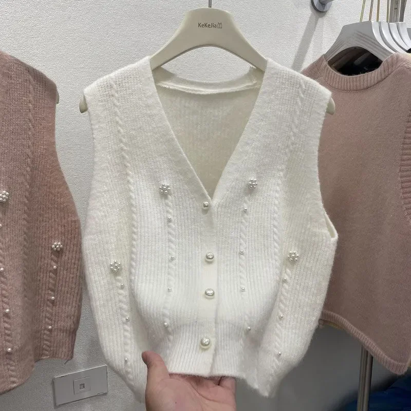 Spring Autumn New Solid V-Neck Beading Knitted Sweater Vest Women Fashion Sleeveless Jacket Knitwear Cardigan Female Tops W682
Spring Autumn New Solid V-Neck Beading Knitted Sweater Vest Women Fashion Sleeveless Jacket Knitwear Cardigan Female Tops W682