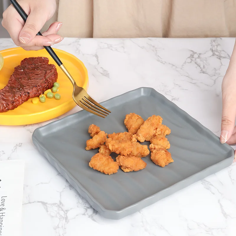 Colored glazed ceramic plate Household solid color plate Hotel pasta plate Western food steak plate Creative square tableware
Colored glazed ceramic plate Household solid color plate Hotel pasta plate Western food steak plate Creative square tableware