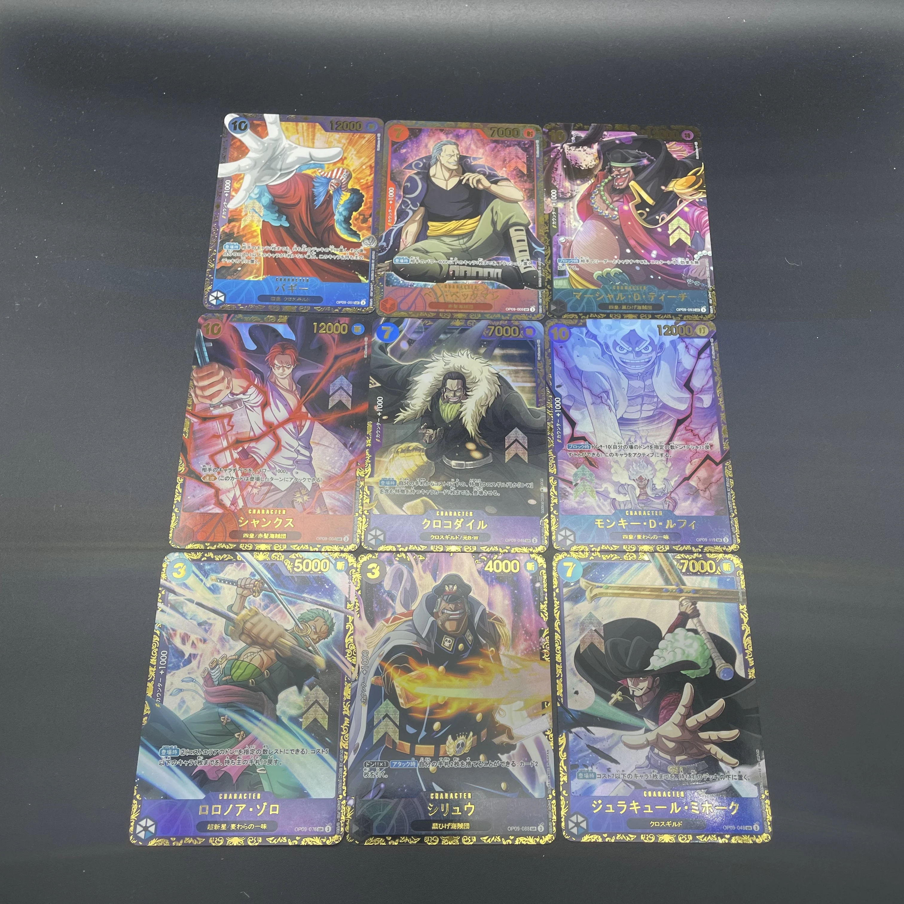 9Pcs/Set OPCG Luffy Bartholomew Kuma Blackbeard Dragon Zoro Urouge Self-made Refractive Color Flash Gilding Collection Card
9Pcs/Set OPCG Luffy Bartholomew Kuma Blackbeard Dragon Zoro Urouge Self-made Refractive Color Flash Gilding Collection Card