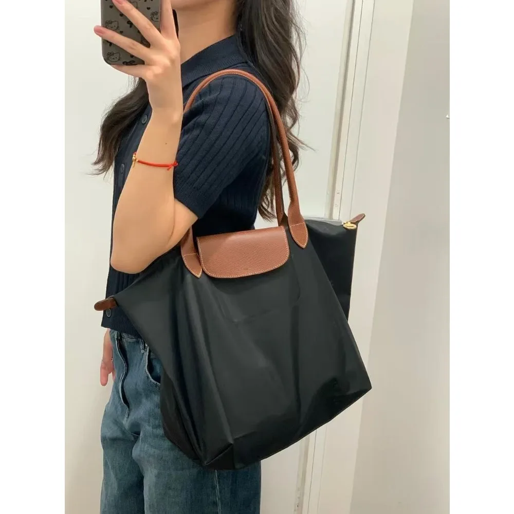 Sac à main pliable en nylon écologique pour femmes Y2K 2026, sac à bandoulière simple grande capacité, sac de banlieue
Sac à main pliable en nylon écologique pour femmes Y2K 2026, sac à bandoulière simple grande capacité, sac de banlieue