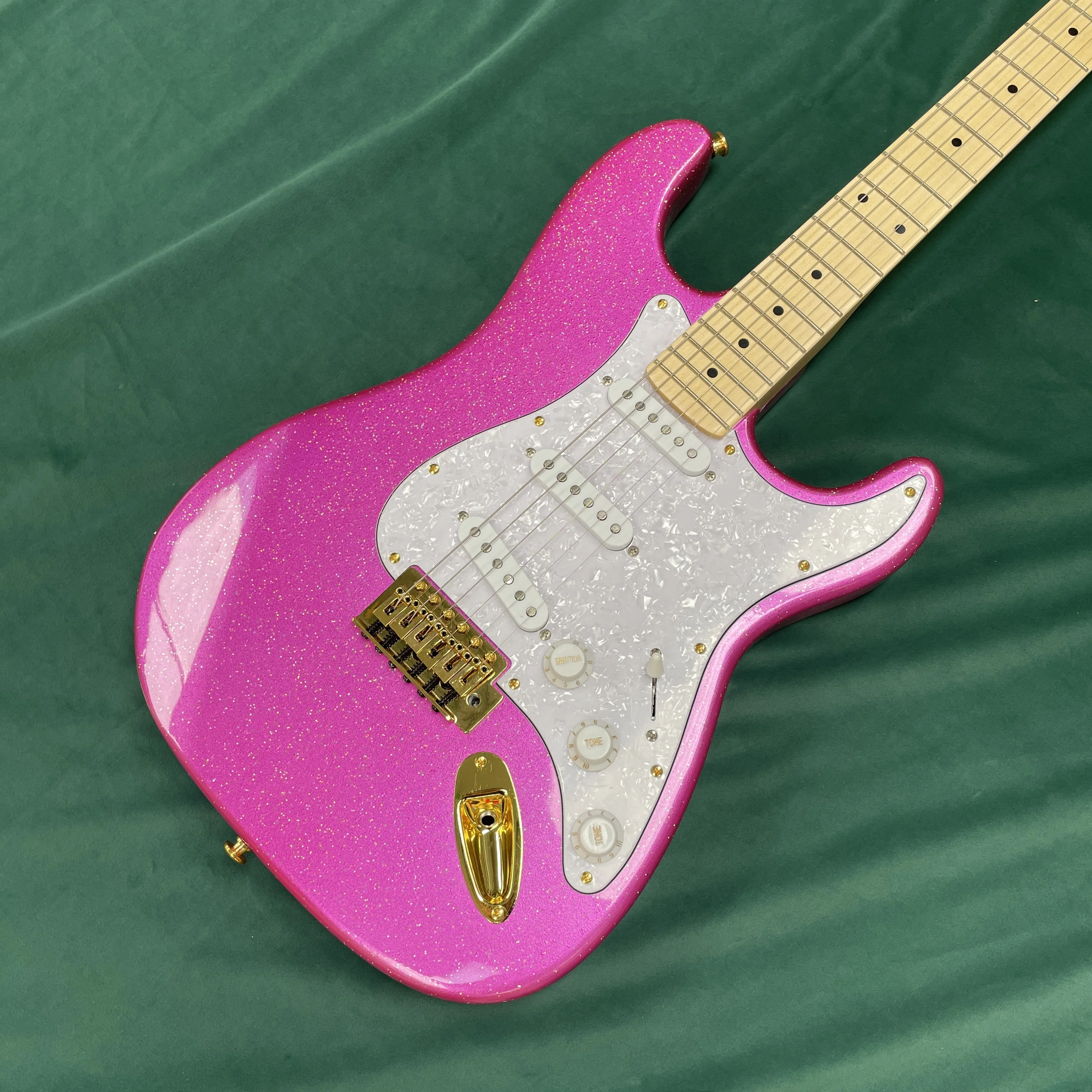 Pink electric guitar with white pearl glitter pickguard and gold hardware guitars, stage performance electric guitarra
Pink electric guitar with white pearl glitter pickguard and gold hardware guitars, stage performance electric guitarra