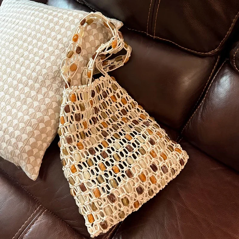 European American Popular Woven Bags Exquisite Beaded Handbag Fashion High-end Shoulder Bag Plaid Hollow Wooden Beads Casual Bag
European American Popular Woven Bags Exquisite Beaded Handbag Fashion High-end Shoulder Bag Plaid Hollow Wooden Beads Casual Bag