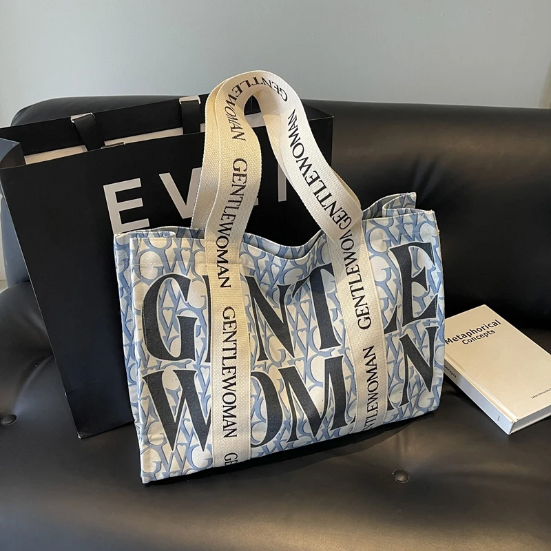 Casual Travel Shoulder Bag Fashion Female Canvas Portable Handbag Letter Print Large Capacity Shopping Bag Korean Style Book Bag
Casual Travel Shoulder Bag Fashion Female Canvas Portable Handbag Letter Print Large Capacity Shopping Bag Korean Style Book Bag
