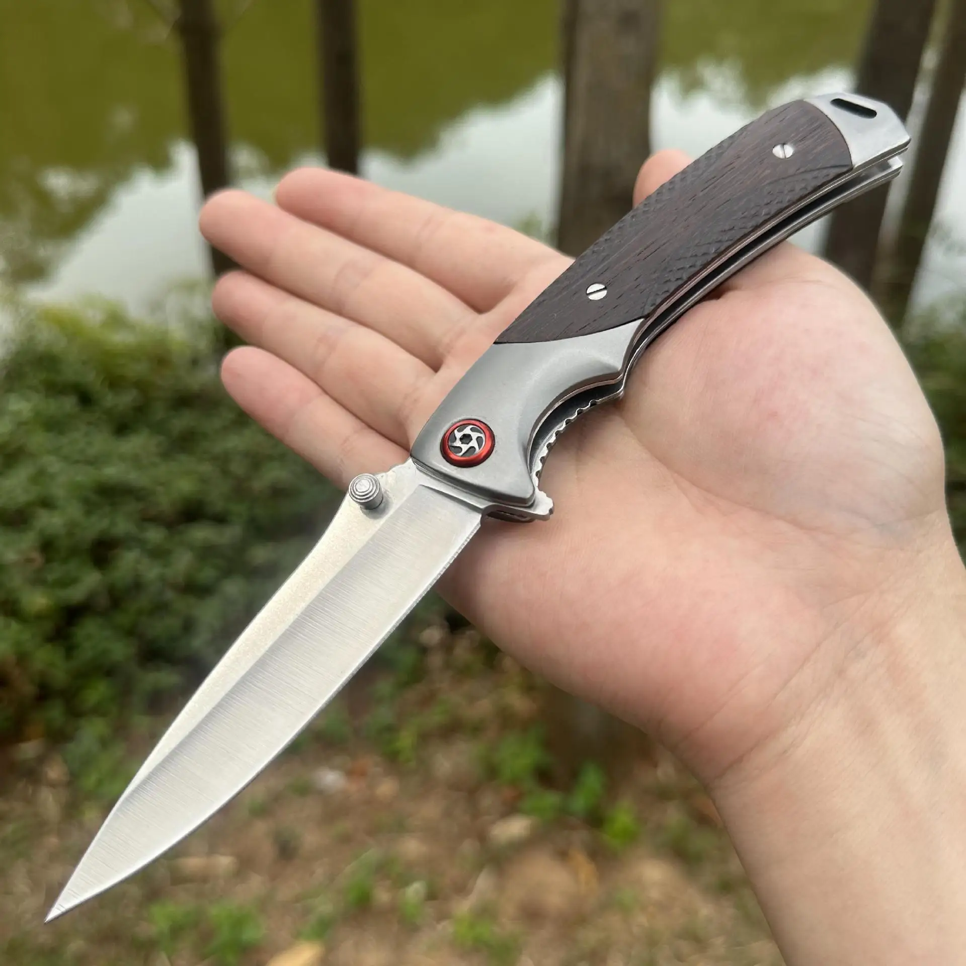 Outdoor portable pocket knife with black/mahogany handle and built-in ball bearings for smooth opening and closing
Outdoor portable pocket knife with black/mahogany handle and built-in ball bearings for smooth opening and closing