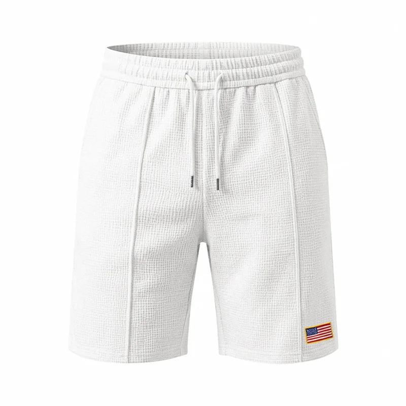 European and American summer men's loose sports and leisure beach waffle embroidered flag five-point sports shorts
European and American summer men's loose sports and leisure beach waffle embroidered flag five-point sports shorts